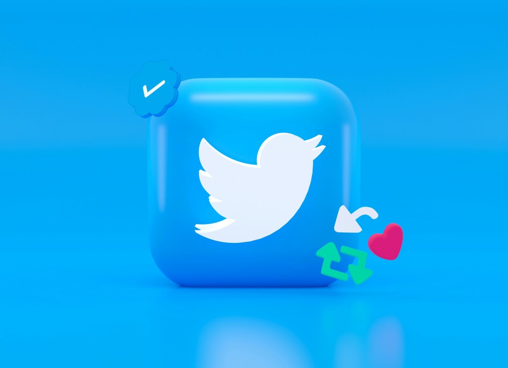 Twitter logo surrounded by the like, tweet, send, and repost icons.